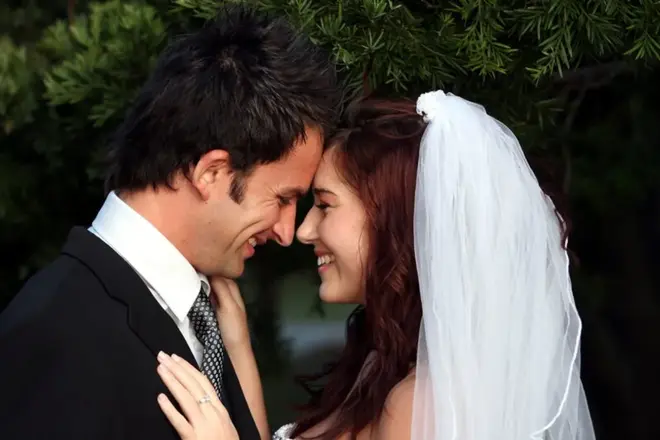 Newlywed couple walking down city hall steps after their elopement ceremony