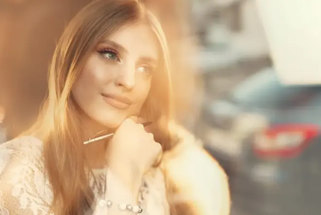 Bride-to-be relaxing with a checklist and coffee the day before her wedding